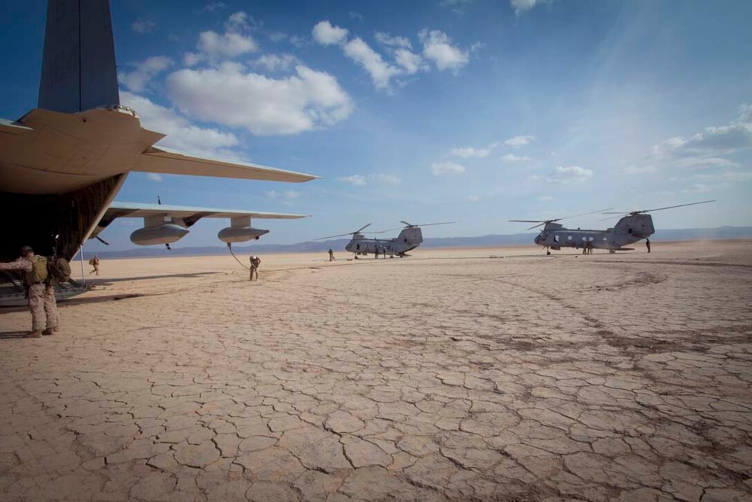 Two CH-46E Sea Stallions with Marine Medium Helicopter 364 (Rein.), 15th Marine Expeditionary Unit, land to refuel during a Mobile Marine Air Traffic Control training evolution in Djibouti, Jan 4.   The mission for the MMT, or "pathfinders" as they're colloquially referred to, is to establish an assault landing zone (runway) and provide air traffic control for multiple aircraft as well as command and control during the entire refuel/resupply mission.  The 15th MEU is deployed as part of the Peleliu Amphibious Ready Group as a U.S. Central Command theater reserve force, providing support for maritime security operations and theater security cooperation efforts in the U.S. 5th Fleet area of responsibility.  (U.S. Marine Corps photo by Gunnery Sgt. Jennifer Antoine)