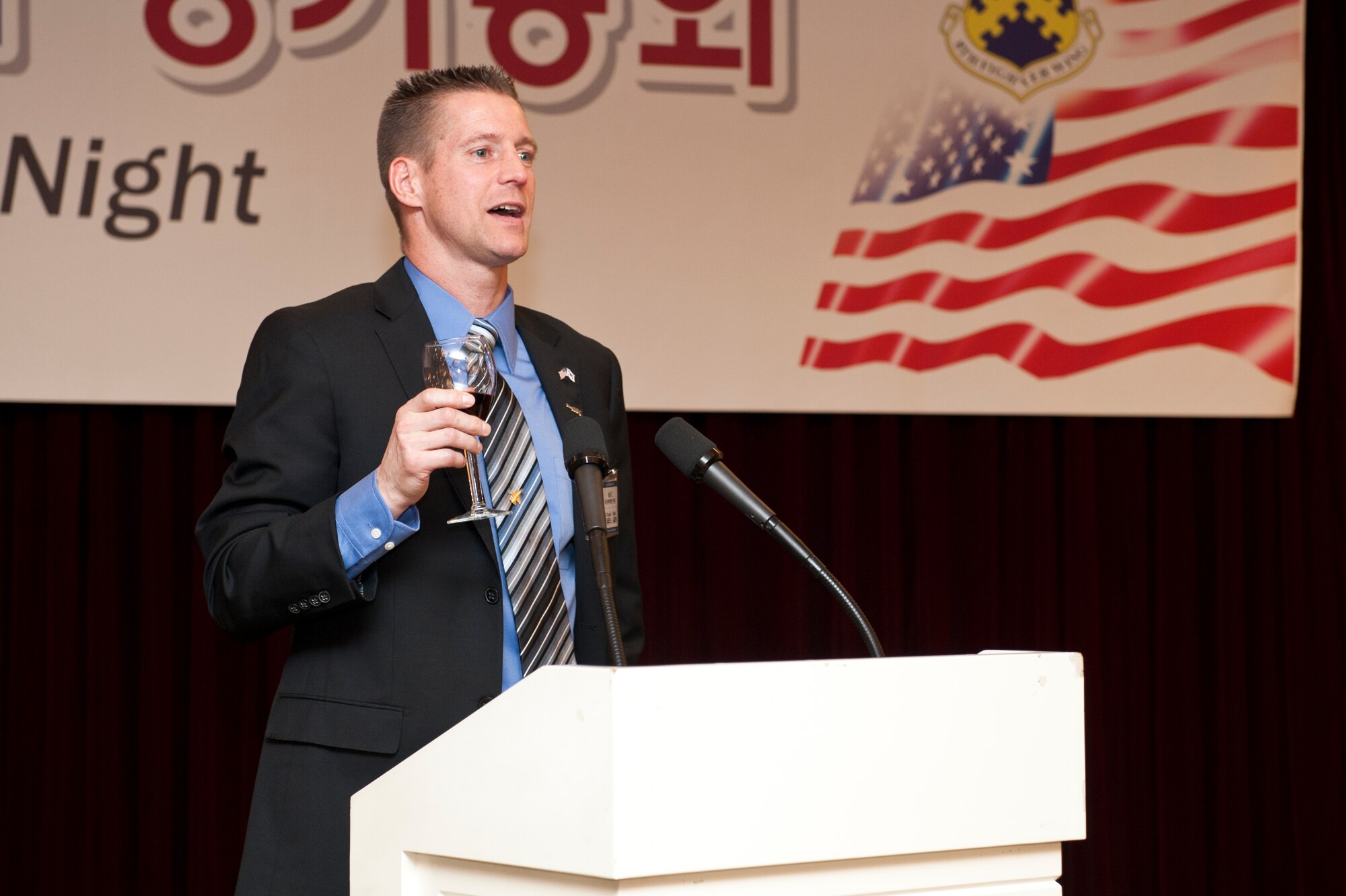 Col. Douglas Nikolai, 8th Fighter Wing vice commander, performs a toast for the crowd during the Korean American Friendship Council Friendship Night at Gunsan City, South Korea, Jan. 22, 2013. Nikolai and others from the 8th FW joined members of the KAFC to showcasethe support provided by the 8th FW and KAFC for the Gunsan City community. (U.S. Air Force photo by Staff Sgt. Jonathan Fowler/Released)
