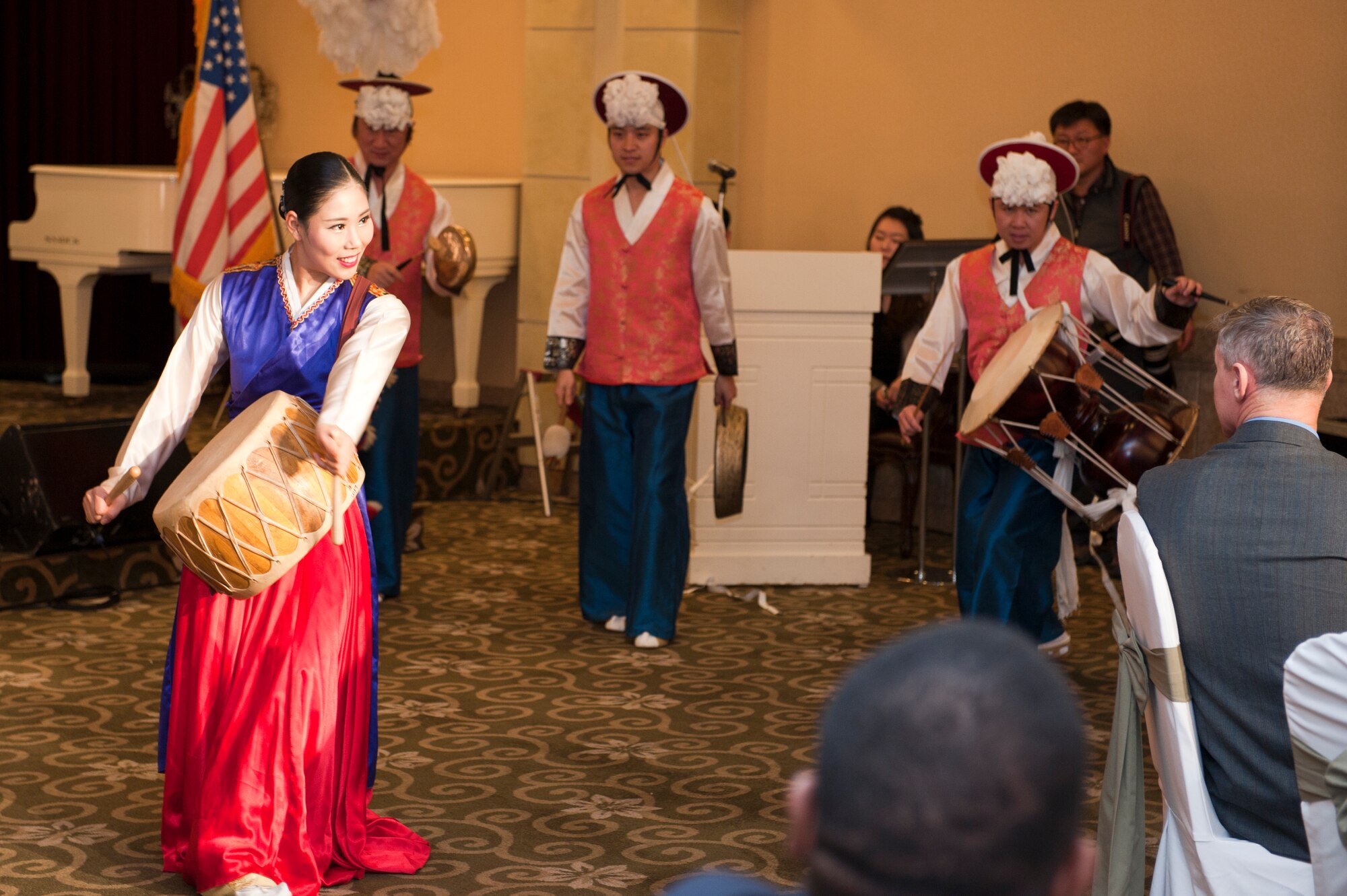 Col. John Pearse, 8th Fighter Wing commander, other 8th FW members and the Korean American Friendship Council enjoy a samulnori performance during the KAFC Friendship Night event at Gunsan City, South Korea, Jan. 22, 2013. The event gave the KAFC a chance to show their appreciation for all the 8th FW has done for the local Gunsan City community.. (U.S. Air Force photo by Staff Sgt. Jonathan Fowler/Released)