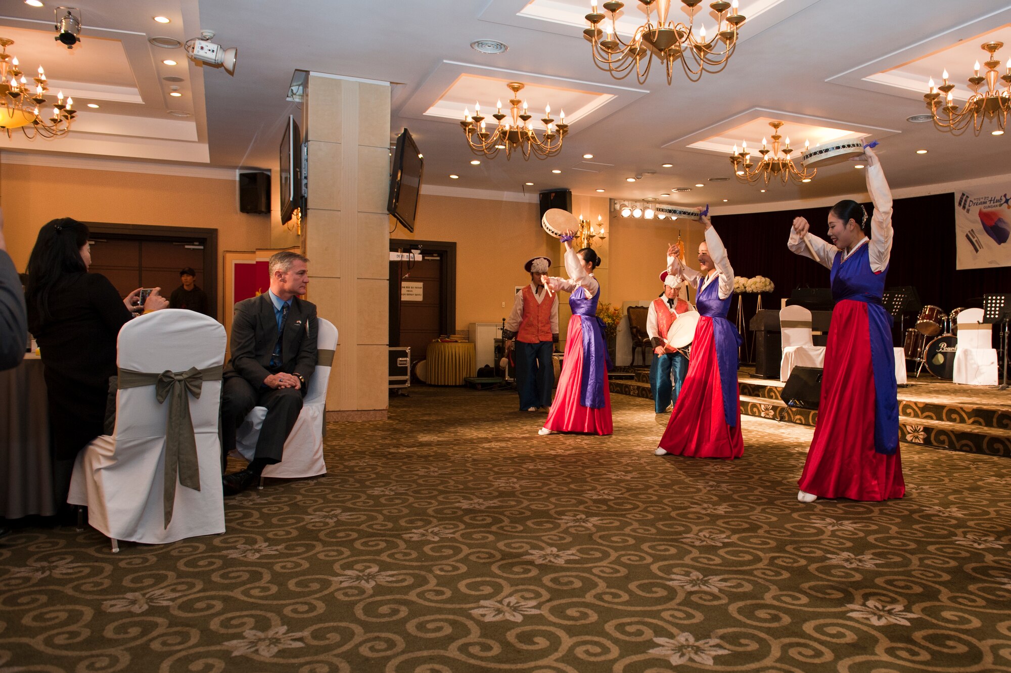 Col. John Pearse, 8th Fighter Wing commander, other 8th FW members and the Korean American Friendship Council enjoy a samulnori performance during the KAFC Friendship Night at Gunsan City, South Korea , Jan. 22, 2013. The event gave the KAFC a chance to show their appreciation for all the 8th FW has done for the local Gunsan City community. (U.S. Air Force photo by Staff Sgt. Jonathan Fowler/Released)