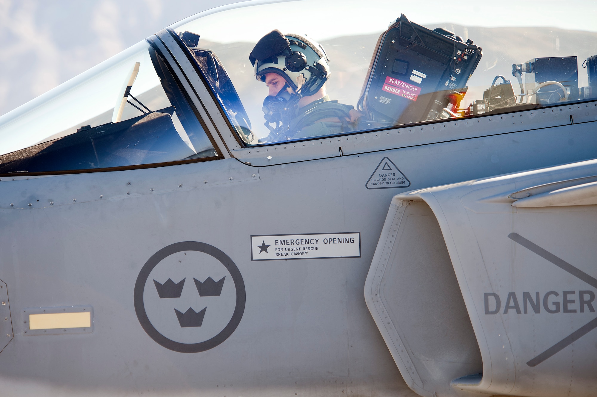 A Swedish Air Force pilot from the 172nd Fighter Squadron prepares to taxi a JAS-39C Gripen at Nellis Air Force Base, Nev., Jan. 21, 2013. The Swedish AF are participating in RED FLAG 13-2 to maximize air combat readiness in a realistic training environment. (U.S. Air Force photo by Lawrence Crespo)