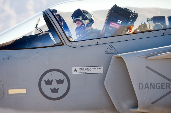 A Swedish Air Force pilot from the 172nd Fighter Squadron prepares to taxi a JAS-39C Gripen at Nellis Air Force Base, Nev., Jan. 21, 2013. The Swedish AF are participating in RED FLAG 13-2 to maximize air combat readiness in a realistic training environment. (U.S. Air Force photo by Lawrence Crespo)