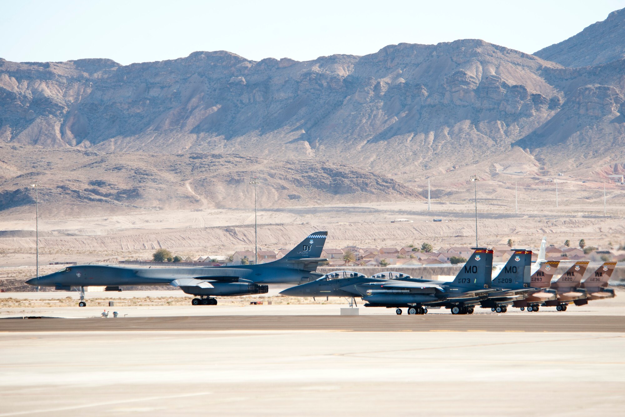 A U.S. Air Force B-1B Lancer from Dyess Air Force Base, Texas, prepares to take off during day one of RED FLAG 13-2 at Nellis Air Force Base, Nev., Jan. 21, 2013. Red Flag provides a realistic air-to-air training environment for forces preparing to support worldwide combat operations.
 (U.S. Air Force photo by Lawrence Crespo)

