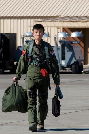 A Republic of Singapore Air Force pilot from the 425th Fighter Squadron, Luke Air Force Base, Ariz., steps toward an F-16 Fighting Falcon during RED FLAG 13-2 Jan. 21, 2013, at Nellis Air Force Base, Nev. RSAF pilots and maintainers are assigned to the 425th Fighter Squadron for two years. (U.S. Air Force photo by Staff Sgt. William P. Coleman)  