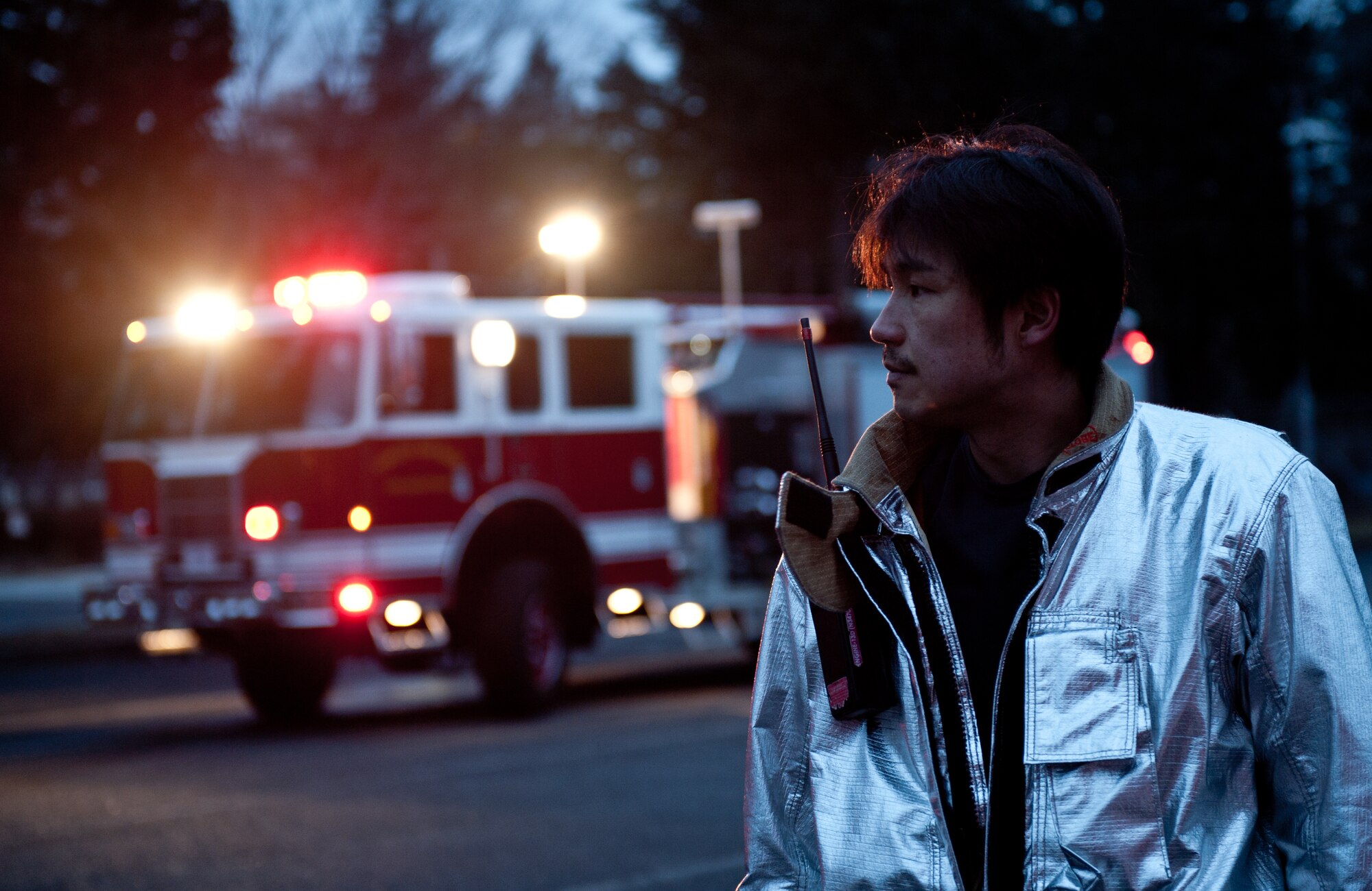 YOKOTA AIR BASE, Japan -- A 374th Civil Engineer Squadron fire protection member takes a break after responding to an incident during an Emergency Management Exercise at Yokota Air Base, Japan, Jan. 22, 2013. The EME prepared Yokota for possible real-world situations requiring response and communication between base-wide organizations. (U.S. Air Force photo by Senior Airman Cody H. Ramirez)