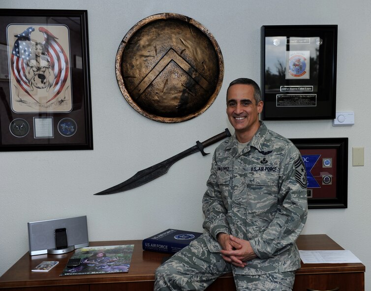 U.S. Air Force Chief Master Sgt. Ramon Colon-Lopez, 18th Wing command chief, sits among decorations in his office at the 18th Wing Headquarters on Kadena Air Base, Japan, Jan. 18, 2013. Colon-Lopez joined the Air Force after a year of college and became a pararescueman in 1996. Before taking the 18th Wing command chief position, Colon-Lopez was the 1st Special Operations Wing command chief at Hurlburt Field, Fla. (U.S. Air Force photo/Airman 1st Class Hailey R. Davis)