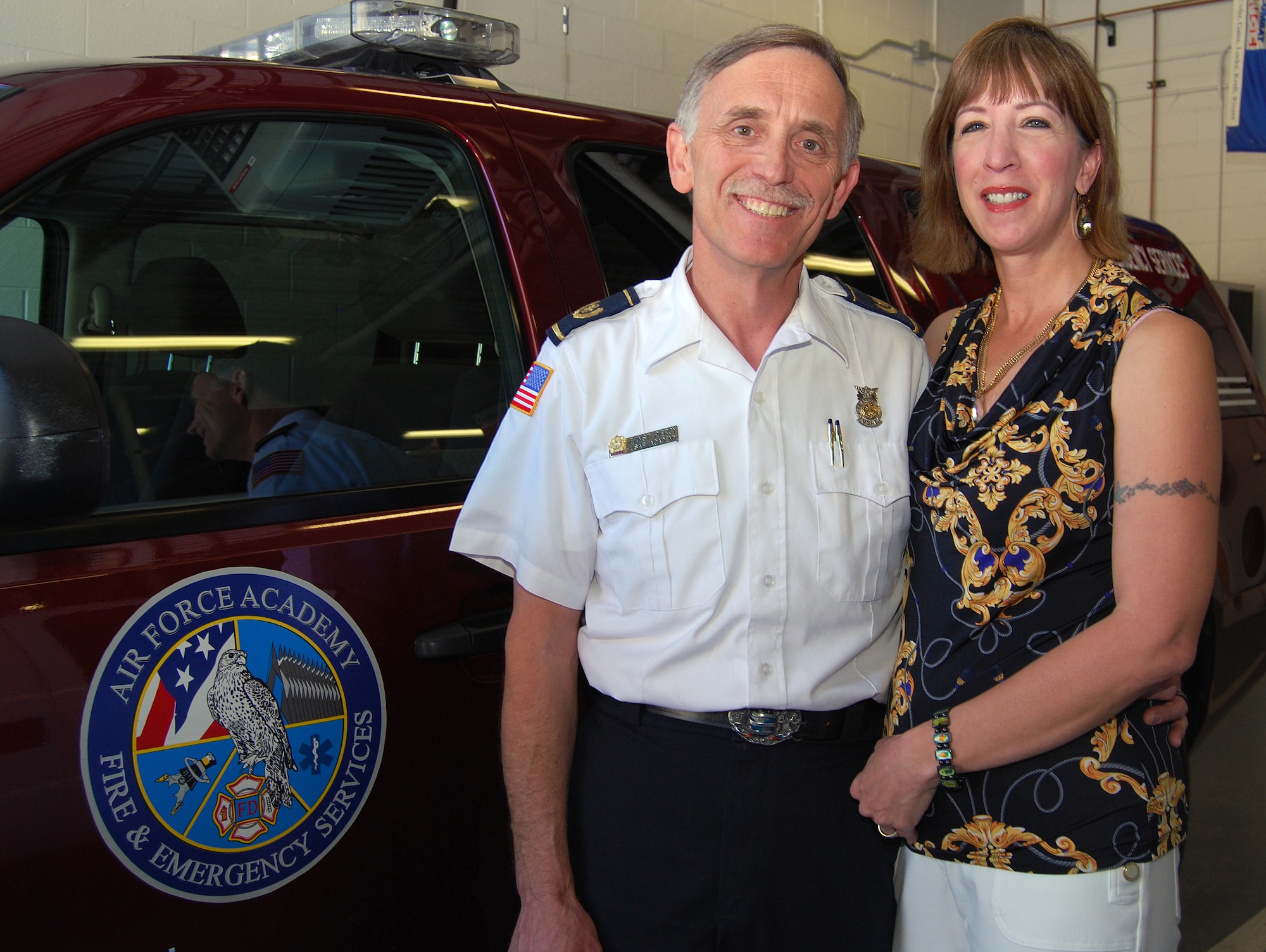 Air Force Academy Fire Chief Piercy Ernst poses for a photo with his wife, Linda, inside Fire Station 1 at the Academy Jan. 18, 2013. Piercy, who has worked at the Academy since 1985, departed Jan. 23 to take a job as fire chief for U.S. Navy Region Southwest, which includes California, Nevada, New Mexico, Arizona, Colorado and Utah. (U.S. Air Force photo/Don Branum)