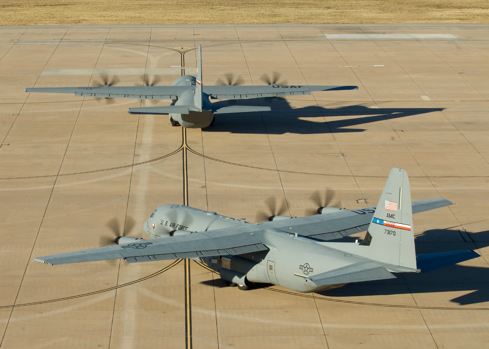 C-130Js assigned to the 317th Airlift Group taxi toward the runway during an Operational Readiness Exercise Jan. 18, 2013, at Dyess Air Force Base, Texas. The purpose of the ORE was to validate the combat readiness of 317th AG units and their ability to execute assigned missions and tasks against a defined standard. Furthermore, six of the 12 C130Js continued on to Little Rock Air Force Base, Ark., to participate in a Joint Readiness Training Center exercise. (U.S. Air Force photo by Airman 1st Class Kylsee Wisseman/Released)