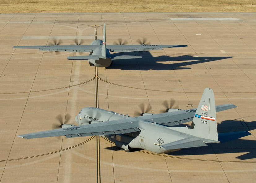 U.S. Air Force C-130Js from Dyess Air Force Base, Texas, taxi toward the runway prior to taking-off for a Joint Readiness Training Center exercise Jan. 18, 2013, at Little Rock Air Force Base, Ark. The 317th AG participated in their second JRTC exercise this year May 13-22, providing aircrews ample training on the ground and in the air. (U.S. Air Force photo by Airman 1st Class Kylsee Wisseman/Released)