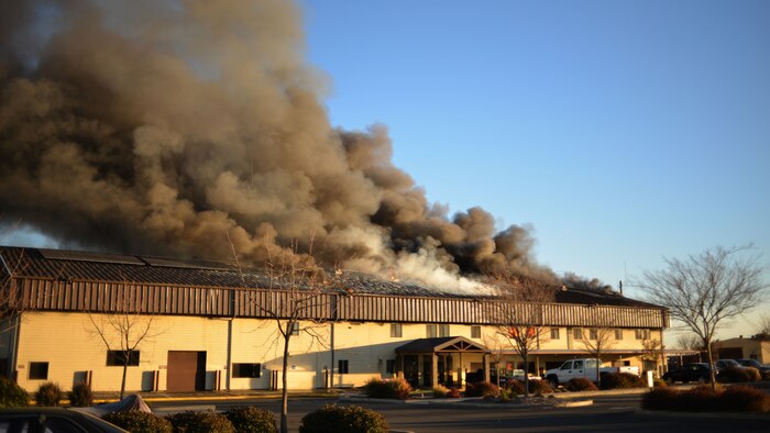 A structure fire burns at the 9th Civil Engineer Squadron building Jan. 21, 2013, at Beale Air Force Base, Calif. (U.S. Air Force photo by Airman 1st Class Drew Buchanan/Released)
