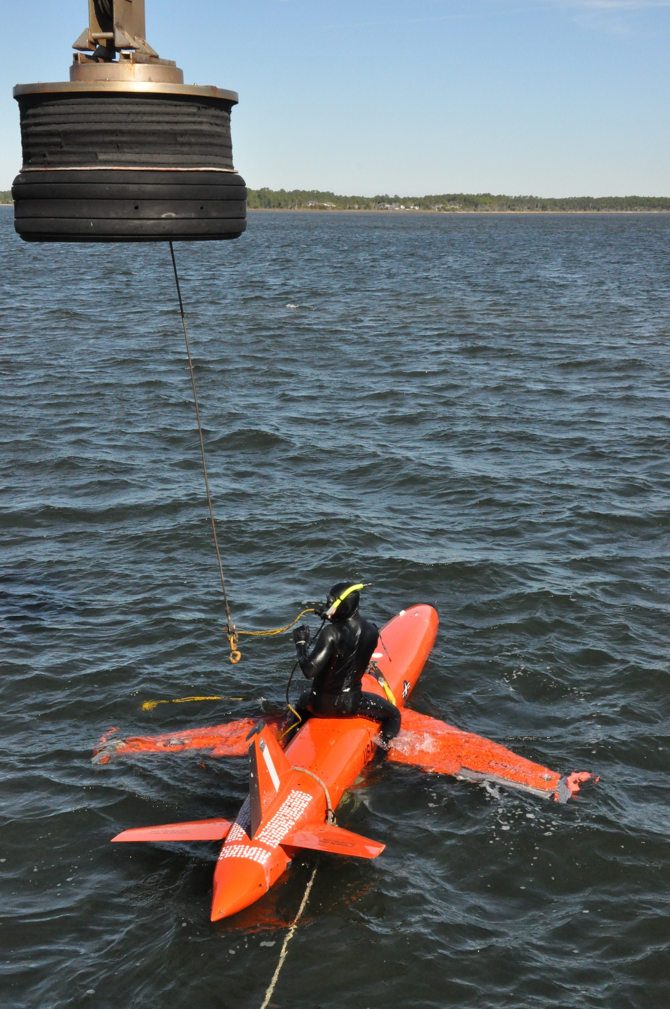 Mr. Chris Geradine, 82nd Aerial Targets Squadron Missile Retriever commercial diver, prepares to recover a BQM-167A drone during a training run. (U.S. Air Force photo by Staff Sgt. Rachelle Elsea)