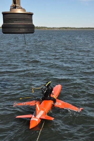 Chris Geradine, 82nd Aerial Targets Squadron Missile Retriever commercial diver, prepares to recover a BQM-167A drone during a training run. (U.S. Air Force photo by Staff Sgt. Rachelle Elsea/Released) 


