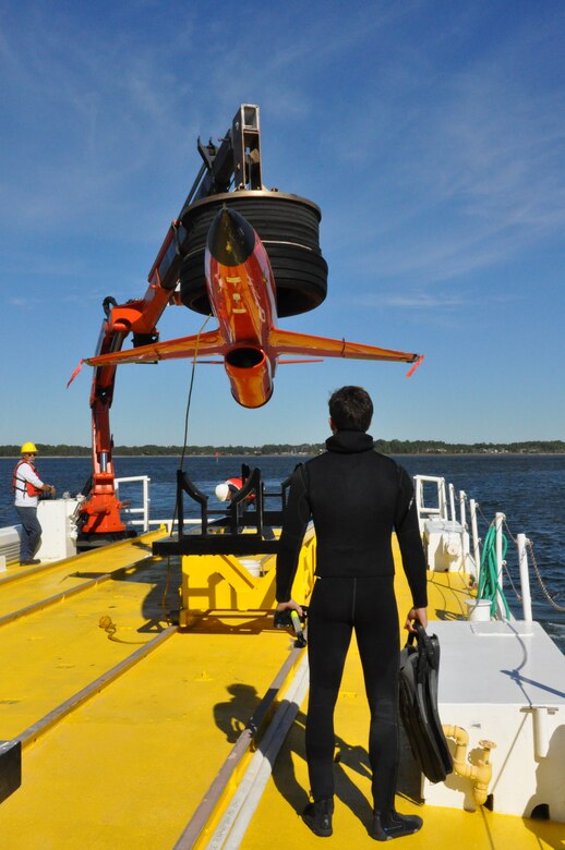 Mr. Chris Geradine, 82nd Aerial Targets Squadron Missile Retriever commercial diver, prepares to recover a BQM-167A drone during a training run. (U.S. Air Force photo by Staff Sgt. Rachelle Elsea)