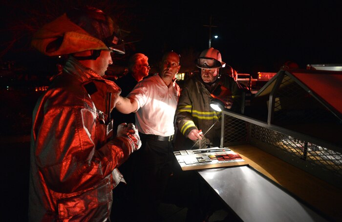 Firefighters work to extinguish a blaze at the 9th Civil Engineer Squadron building Jan. 21, 2013, at Beale Air Force Base, Calif. (U.S. Air Force photo by Airman 1st Class Drew Buchanan/Released)
