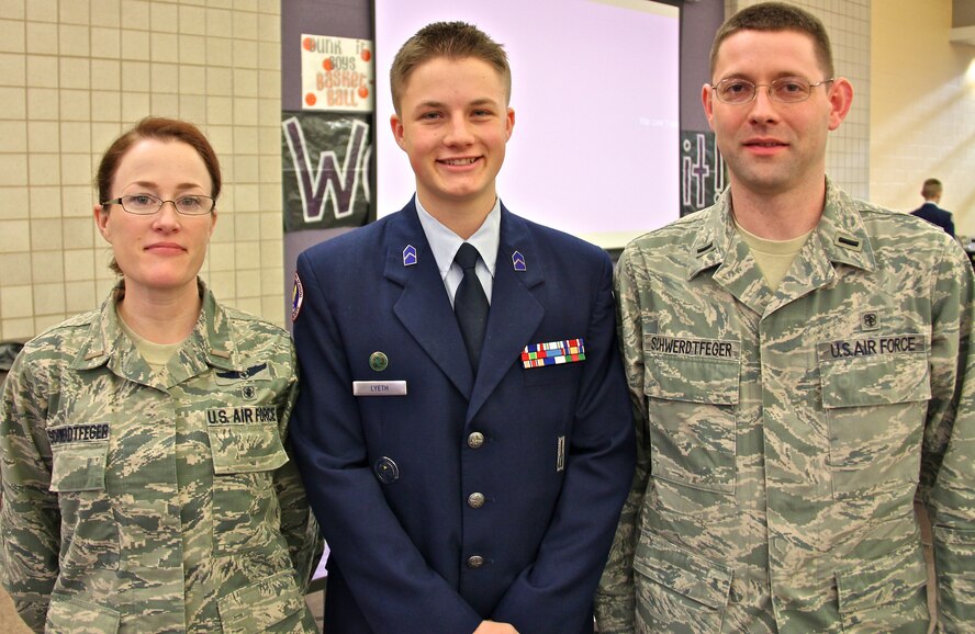 Second Lt. Melanie Schwerdtfeger, 932nd Aerospace Evacuation Squadron,  with her son  and husband, First Lt. Steven Schwerdtfeger, of the 375th Medical Group. They attended the Mascoutah High School Air Force JROTC awards ceremony on Jan. 17.  The 932nd Airlift wing formally "adopted" the ROTC detachment several years ago.   (U.S. Air Force photo/Tech. Sgt. Dan Oliver)  