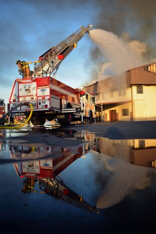 Firefighters from Beale Air Force Base and other local fire departments battle a structure fire at the 9th Civil Engineer building Jan. 21, 2013, at Beale Air Force Base, Calif. (U.S. Air Force photo by Airman 1st Class Drew Buchanan/Released)
