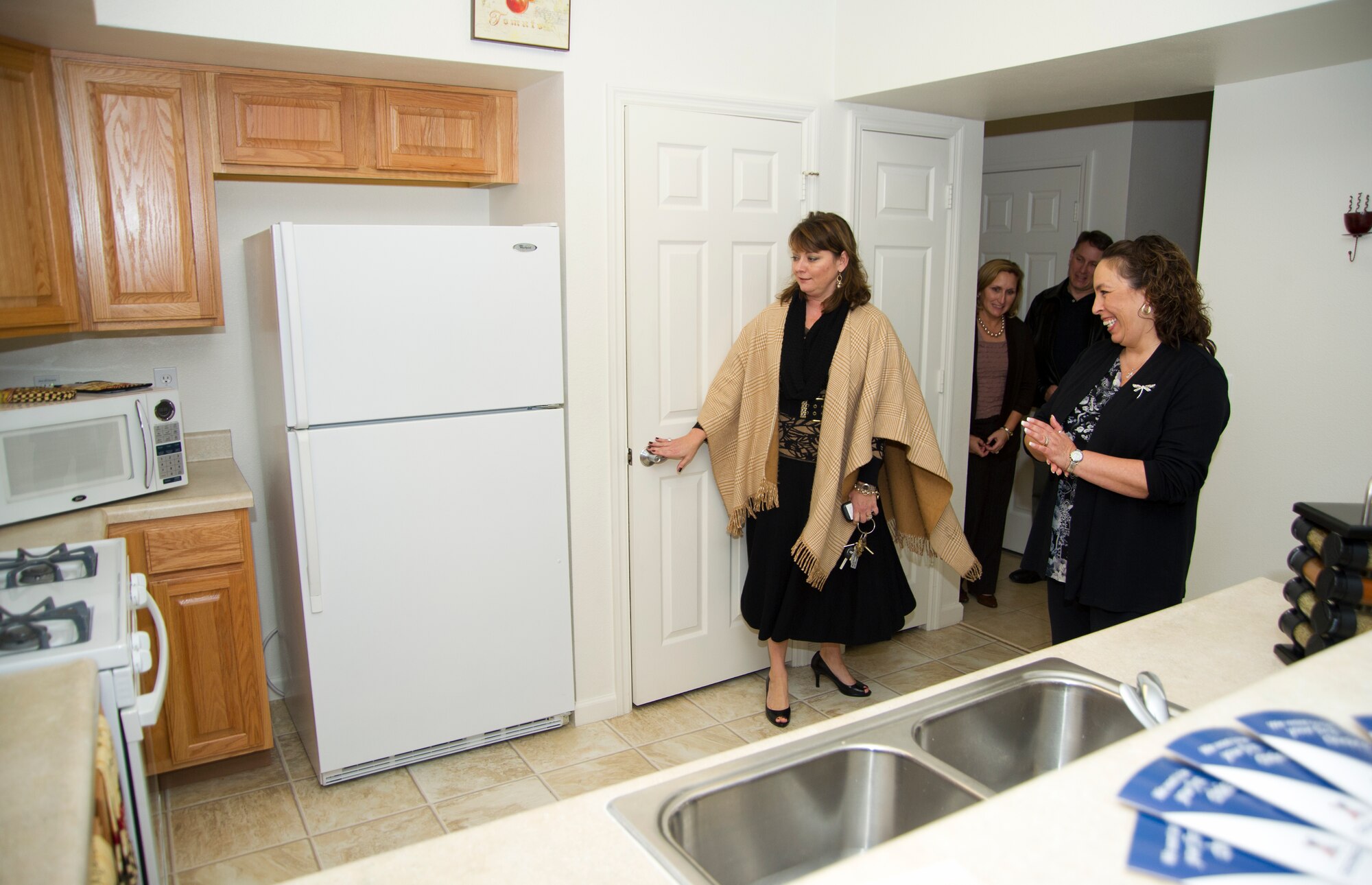 Vickie Deihl, community manager for the housing contract privatization, shows off a model kitchen in West Falcon to Lisa Battaglia, spouse of Marine Sgt. Maj. Bryan Battaglia, senior enlisted advisor to the Chairman of the Joint Chiefs of Staff, during a tour of base housing Jan. 16, 2013, at Keesler Air Force Base, Miss.  Sgt. Maj. Battaglia’s one-day visit allowed him the opportunity to acquaint himself with Keesler’s people, mission and contribution to the bigger military picture.  He also talked to enlisted Keesler members about the CJCS’ four priorities, his own key themes and his thoughts on bridging the basics and total force fitness.  (U.S. Air Force photo by Adam Bond)
