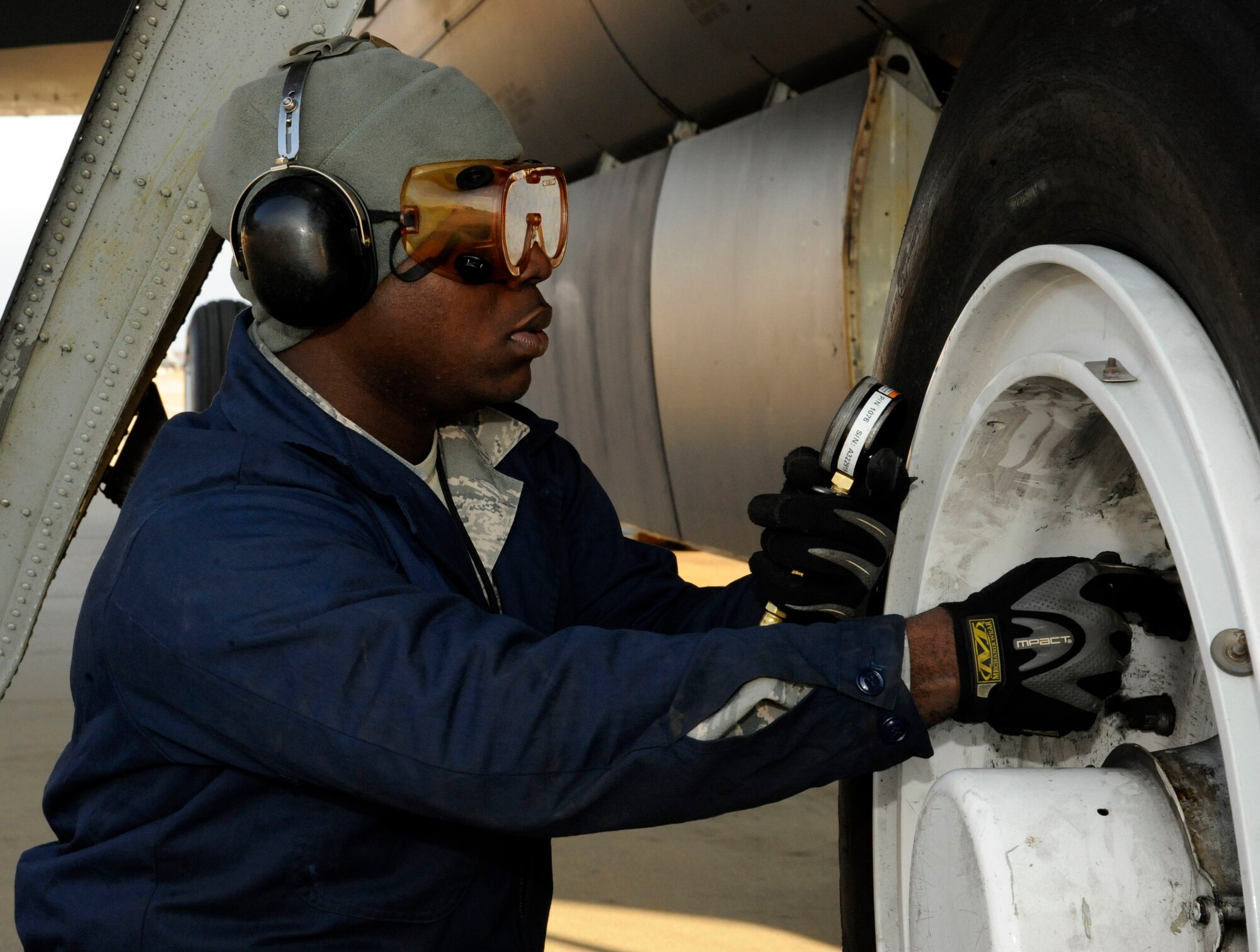 Airman 1st Class Keith Jackson, 707th Maintenance Squadron crew chief, checks the tire pressure of a B-52H Stratofortress during a pre-flight check on Barksdale Air Force Base, La., Jan. 22. Having the right amount of pressure within the tires is vital to the aircraft, if over or under pressure, the tires could have a blow out and prevent the aircraft from taking off or causing major damage during landing. (U.S. Air Force photo/Airman 1st Class Andrew Moua)
