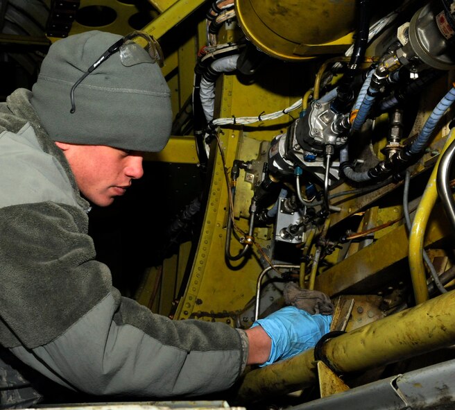 Airman 1st Class Brandon Sangston, 2nd Aircraft Maintenance Squadron crew chief, inspects the hydraulic systems on a B-52H Stratofortress on Barksdale Air Force Base, La., Jan. 22. The hydraulic systems allow the aircraft to maneuver and brake through the use of pressurized fluid. (U.S. Air Force photo/Airman 1st Class Andrew Moua)