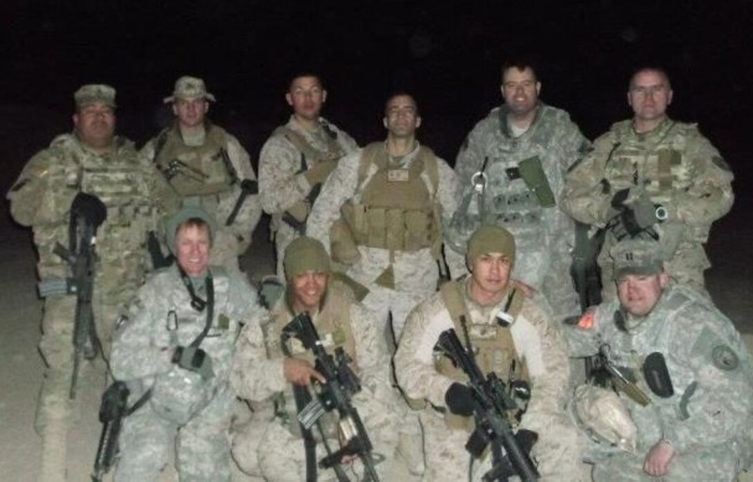 Maj. Jack Spencer, second row right, 507th Air Refueling Wing staff judge advocate, was awarded the Bronze Star recently. Spencer served as the Chief of Detainee Operations to the Combined Joint Interagency Task Force, Kabul, Afghanistan, from September 2011 to October 2012.  Spencer and his team were responsible for providing the Commanding General advice on over 2,100 detainee transfer request, custody request and high value detainee designations.  (Courtesy photo)