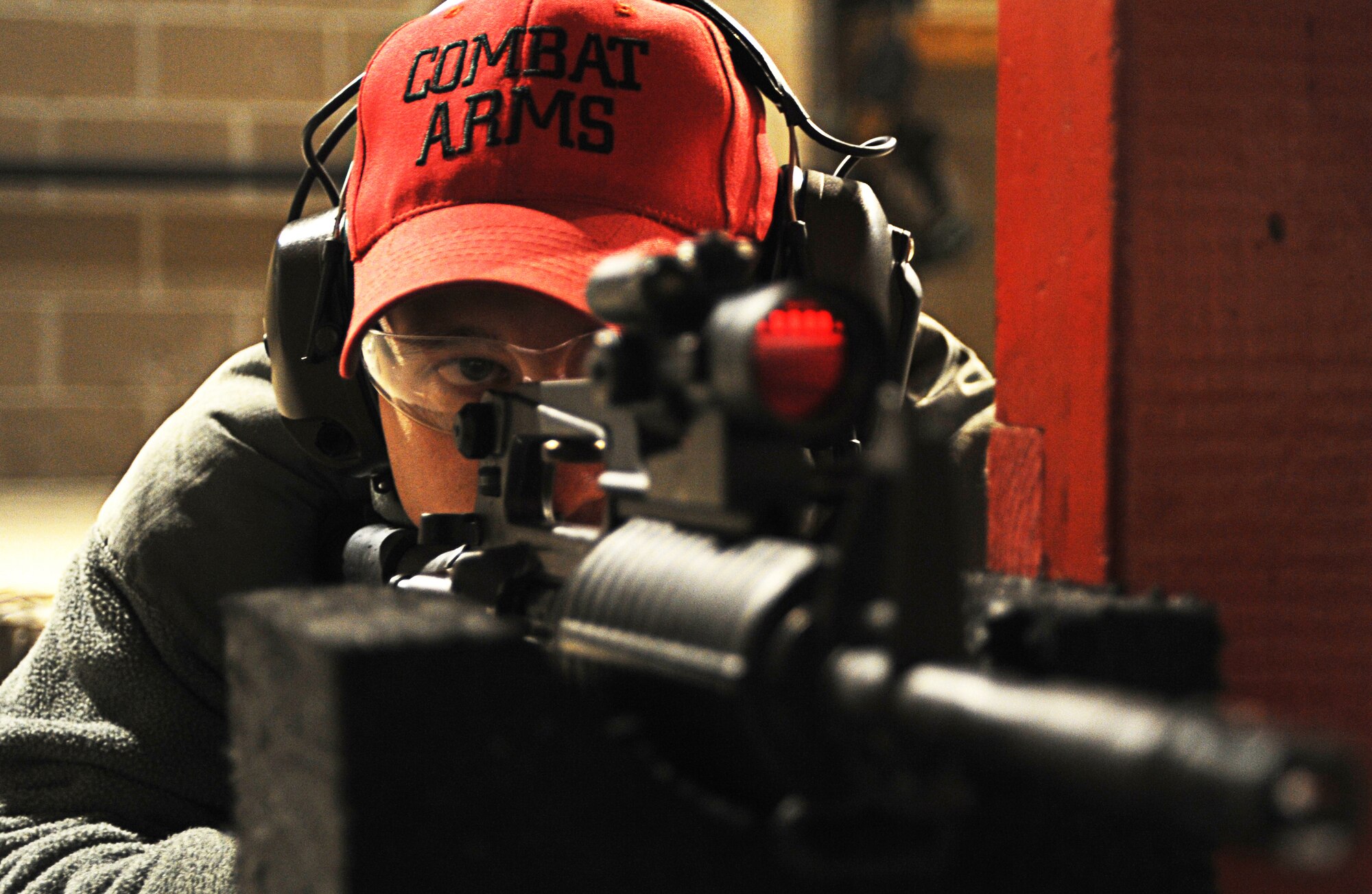 Combat Arms Training and Maintenance instructor Staff Sgt. Jacob Pruitt, 436th Security Forces Squadron, fires an M4 rifle Dec. 6. 2012, during a night firing training session at Dover AFB, Del. (U.S. Air Force photo/ Staff Sgt. Liliana Moreno)
