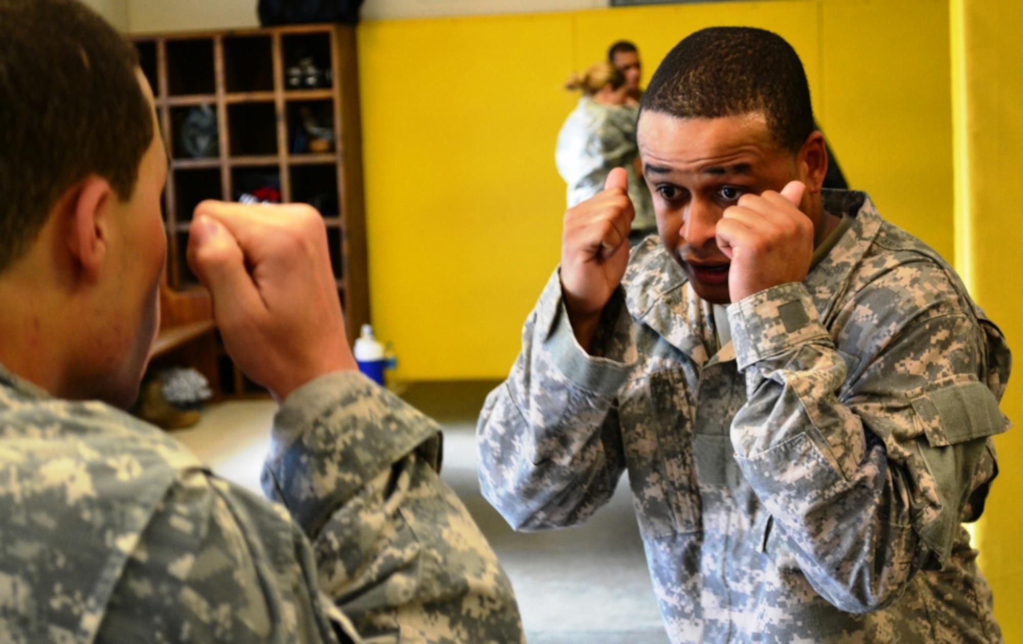Two Soldiers square off during option-three drills during day three of the 40-hour Modern Combatives Program at the Fort Eustis Combatives Academy at Fort Eustis, Va., Jan 9, 2012. The first two days of the 40-hour Level-One course cover striking and protection drills, while day three features option three drills and provides the first opportunity for Soldiers to get hands-on experience. (U.S. Army photo by Sgt. Edwin Rodriguez/Released)