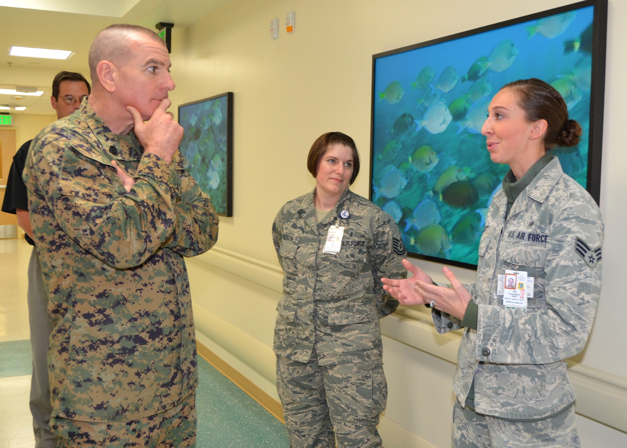Marine Sgt. Maj. Bryan Battaglia, senior enlisted advisor to the Chairman of the Joint Chiefs of Staff is briefed by Tech. Sgt. Amy French, 81st Medical Operations Squadron Mental Health Flight chief, and Senior Airman Elizabeth Mast, Mental Health Clinic technician, about mental health resiliency during his visit to the 81st Medical Group Back Bay Tower Jan. 16, 2013, at Keesler Air Force Base, Miss.  Battaglia’s one-day visit allowed him the opportunity to acquaint himself with Keesler’s people, mission and contribution to the bigger military picture.  He also talked to enlisted Keesler members about the CJCS’ four priorities, his own key themes and his thoughts on bridging the basics and total force fitness.  (U.S. Air Force photo by Steve Pivnick)