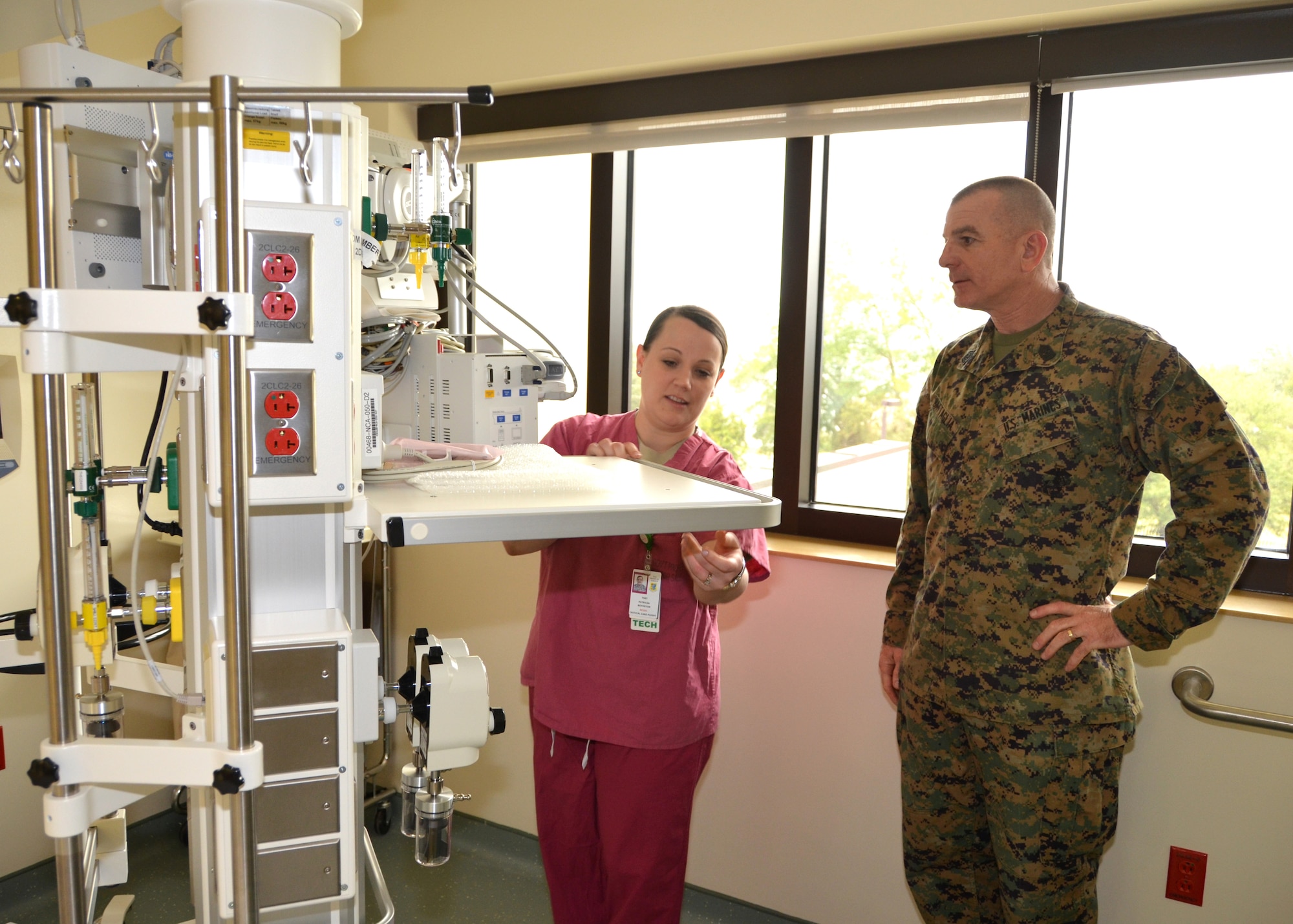 Tech. Sgt. Patricia Boydston, NCO-in-charge of the 81st Inpatient Operations Squadron Intensive Care Unit, demonstrates the unit’s state-of-the art equipment boom system to Marine Sgt. Maj. Bryan Battaglia, senior enlisted advisor to the Chairman of the Joint Chiefs of Staff, during his visit to the 81st Medical Group Back Bay Tower Jan. 16, 2013, at Keesler Air Force Base, Miss.  Battaglia’s one-day visit allowed him the opportunity to acquaint himself with Keesler’s people, mission and contribution to the bigger military picture.  He also talked to enlisted Keesler members about the CJCS’ four priorities, his own key themes and his thoughts on bridging the basics and total force fitness.  (U.S. Air Force photo by Steve Pivnick)