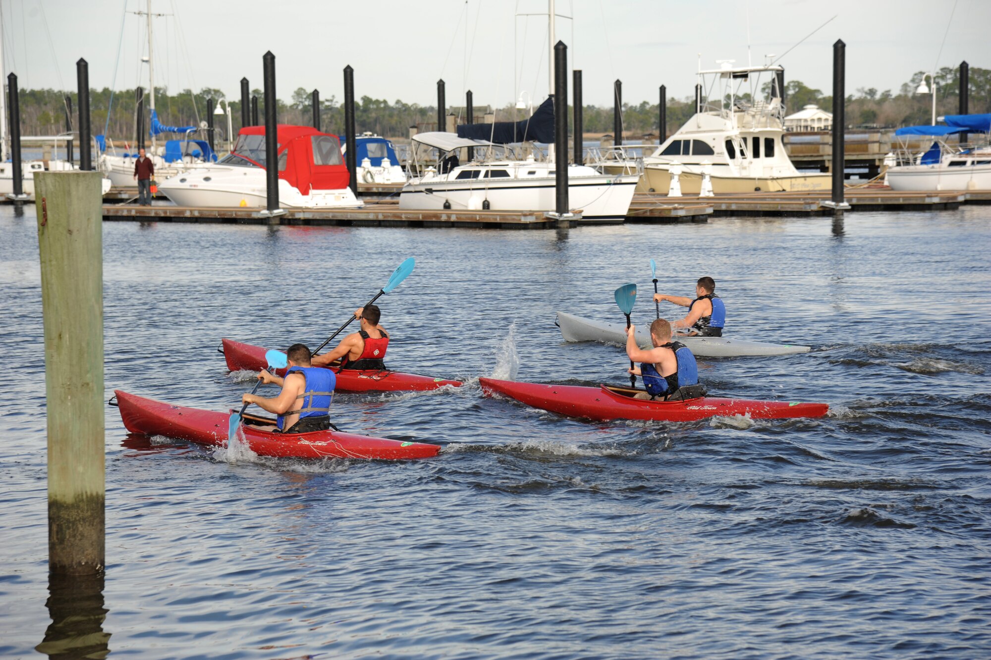 The first heat kayak their way through the marina during the polar bear regatta Jan. 19, 2013, at Keesler Air Force Base, Miss.  The event was sponsored by outdoor recreation.  (U.S. Air Force photo by Kemberly Groue)