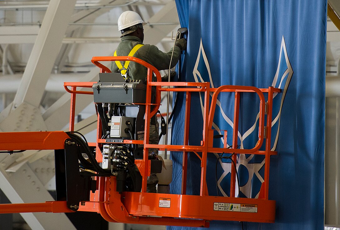 Senior Airman Derek Lawson, 11th Civil Engineer Squadron structural apprentice, steams the wrinkles out of the U.S. Air Force banner Jan. 22, 2013 at Joint Base Andrews, Md., in preparation for the Chief Master Sergeant of the Air Force Transition Ceremony here, Jan 24. On Wednesday, Chief Master Sgt. James A. Cody will become the 17th CMSAF, following the retirement and transition of Chief Master Sgt. of the Air Force James Roy. Roy's retirement will culminate more than 30 years of service. (U.S. Air Force photo /Staff Sgt. Perry Aston)