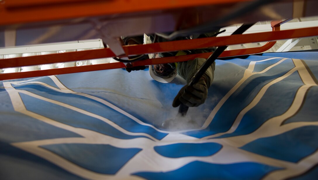 Senior Airman Derek Lawson, 11th Civil Engineer Squadron structural apprentice, steams the wrinkles out of the U.S. Air Force banner Jan. 22, 2013 at Joint Base Andrews, Md., in preparation for the Chief Master Sergeant of the Air Force Transition Ceremony here, Jan 24. On Wednesday, Chief Master Sgt. James A. Cody will become the 17th CMSAF, following the retirement and transition of Chief Master Sgt. of the Air Force James Roy. Roy's retirement will culminate more than 30 years of service. (U.S. Air Force photo by Staff Sgt. Perry Aston)(Released)