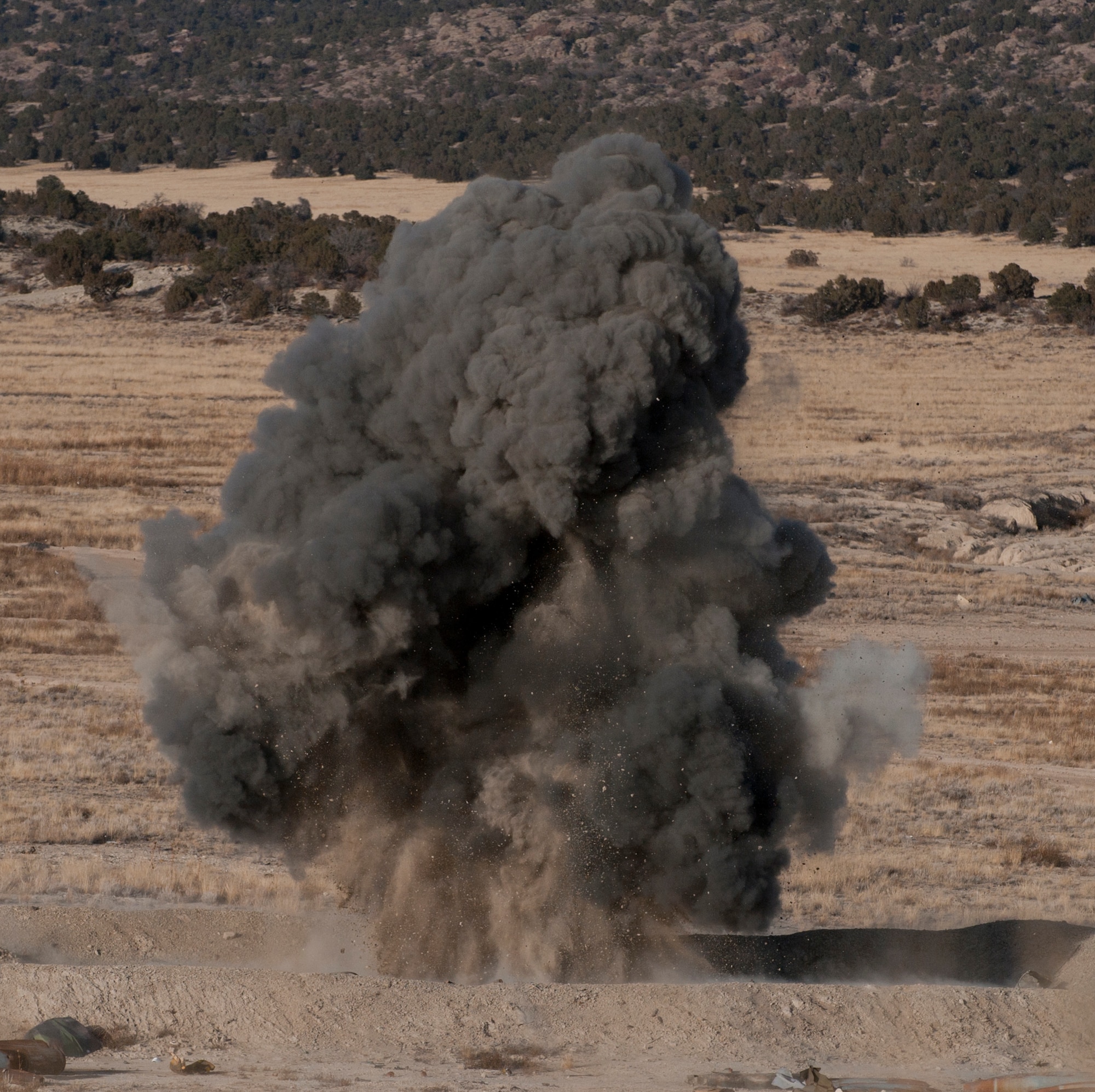 FORT CARSON, Colo. -- The 21st Civil Engineer Squadron explosive ordnance disposal team detonates about 15 pounds of C4 plastic explosive during a training exercise with the 302nd CES EOD team Jan. 10 at Fort Carson. C4 has a detonation velocity of 26,550 feet per second. (U.S. Air Force photo/Senior Airman Jacob Morgan)