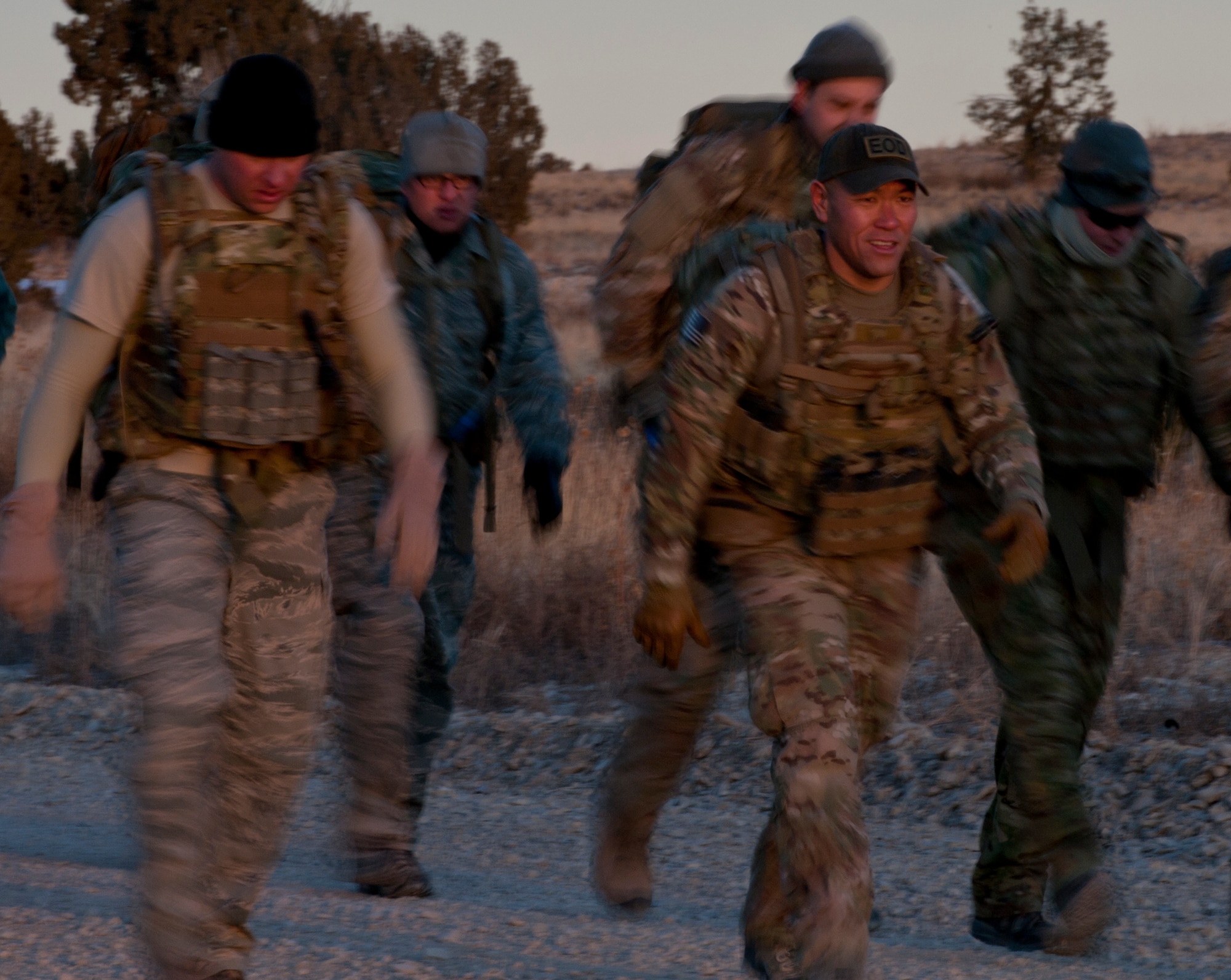 FORT CARSON, Colo. -- Master Sgt. Ross Kurashima, 302nd Civil Engineer Squadron explosive ordnance disposal technician, leads a team of 11 Reservists and active-duty members from the 21st and 302nd CES EOD teams on an 11-mile ruck march Jan. 10, 2013. The EOD teams from Peterson Air Force Base, Colo., have revolutionized the way Reserve and active units can build off of each others strengths by training together for an entire week once per quarter. (U.S. Air Force photo/Senior Airman Jacob Morgan)