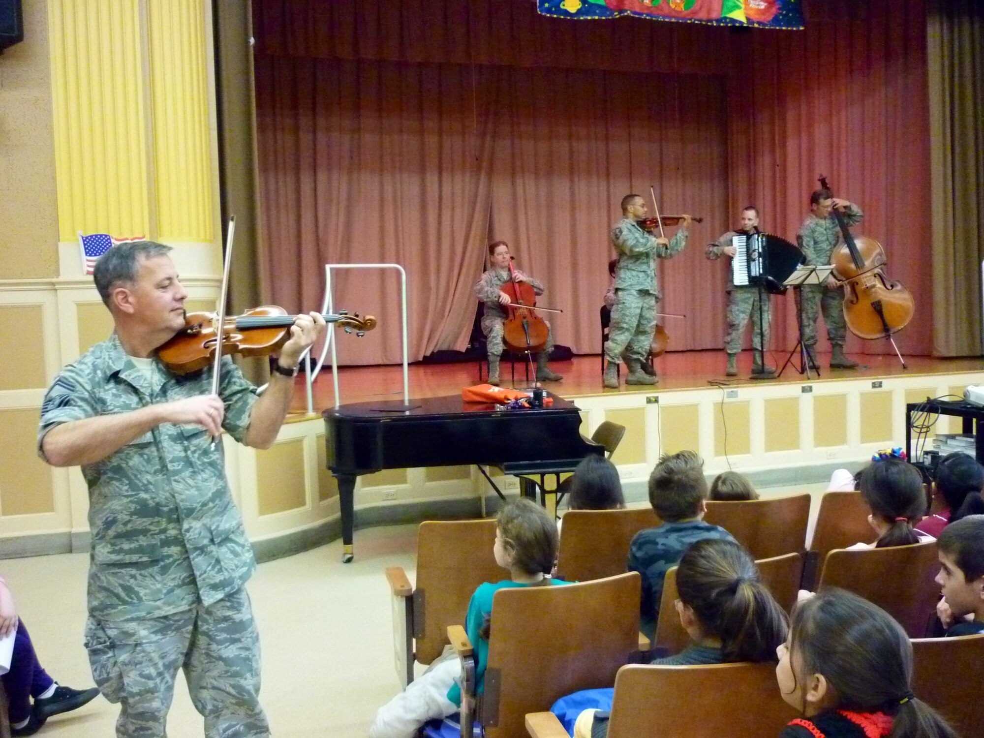 The Strolling Strings playing at Public School 41R, Staten Island, NY (U.S. Air Force photo by TSgt Ni Santiago)
