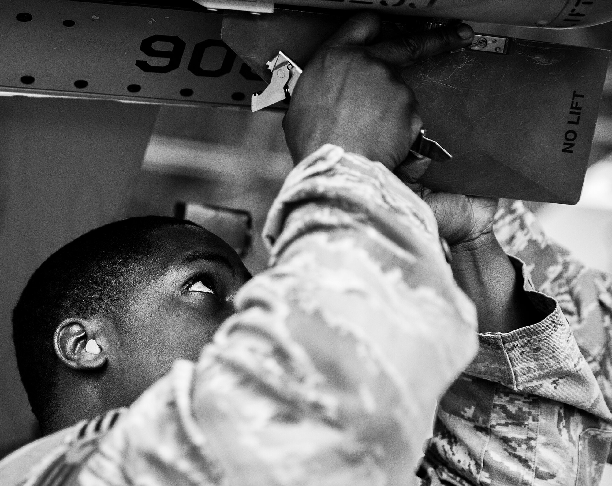 Senior Airman Kevin Hawkins, of the 96th Aircraft Maintenance Squadron Blue, tightens down fins onto an AIM-120 during the 2012 Loadcrew of the Year competition Jan. 18 at Eglin Air Force Base, Fla.  The best of the best maintainers from AMU Red and Blue battled for the title of this yearly competition.  The Blue Team was timed and judged for accuracy of their weapons load of an F-16, while the Red Team was evaluated on an F-15. Although the Blue Team finished first, the competition is still being judged.  The winners will be announced at the 46th Maintenance Group annual awards banquet in March. (U.S. Air Force photo/Samuel King Jr.)