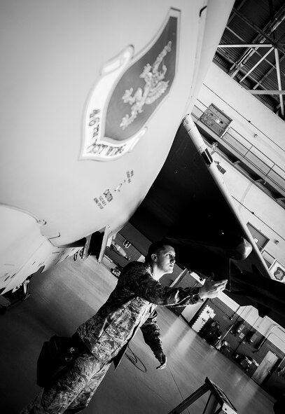 Staff Sgt. Jacob Holst, of the 96th Aircraft Maintenance Squadron Red, evaluates the wing an F-15 during the 2012 Loadcrew of the Year competition Jan. 18 at Eglin Air Force Base, Fla.  The best of the best maintainers from AMU Red and Blue battled for the title of this yearly competition.  The Red Team was timed and judged for accuracy of their weapons load of an F-15, while the Blue Team was evaluated on an F-16. Although the Blue Team finished first, the competition is still being judged.  The winners will be announced at the 96th Maintenance Group annual awards banquet in March. (U.S. Air Force photo/Samuel King Jr.)