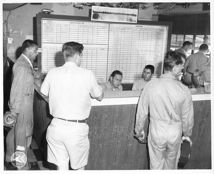 North Carolina Air National Guard, NCANG, 145 Airlift Wing, 145 AW, 156 Fighter Interceptor Squadron (FIS) From Left to Right, #1 George Keller, #2 Bobby Small, #3 Floyd Grice, #4 Fred Hallman, #5 Pilot With Back to Camera is Tom Satterwhite,#6 Back to Camera in bachground is Charles Parsons, #7 Back to Camera, BIll Caton, #8 Right Profile SSgt, Unk, board dated 29 May 1960 (Photo by NCANG Heritage program)