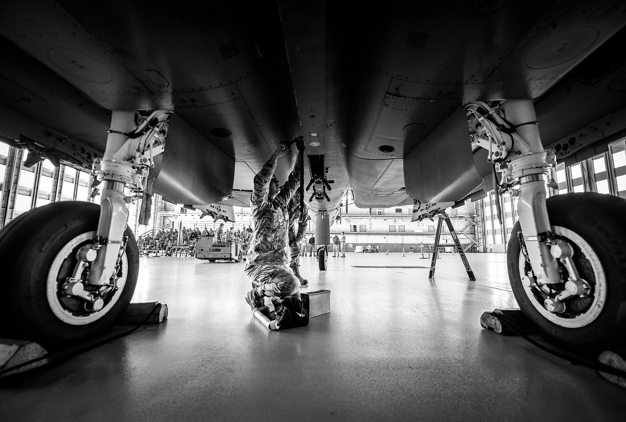 Senior Airman Melissa Higa, of the 96th Aircraft Maintenance Squadron Red, makes an adjustment underneath an F-15 during the 2012 Loadcrew of the Year competition Jan. 18 at Eglin Air Force Base, Fla.  The best of the best maintainers from AMU Red and Blue battled for the title of this yearly competition.  The Red Team was timed and judged for accuracy of their weapons load of an F-15, while the Blue Team was evaluated on an F-16. Although the Blue Team finished first, the competition is still being judged.  The winners will be announced at the 96th Maintenance Group annual awards banquet in March.  (U.S. Air Force photo/Samuel King Jr.)