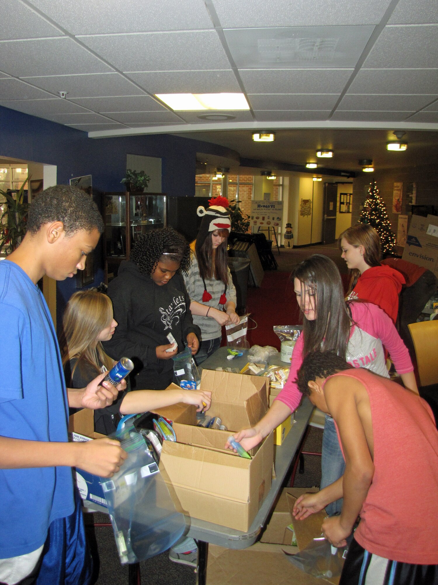 Teens from the Keystone Club at the R.P. Lee Youth Center package hygiene products to pass out during the Holidays for the Homeless dinner Dec. 22. The teens served 250 meals to the homeless downtown and passed out  213 hygiene packets, as well as coats, scarves, gloves, hats, shoes and toys. The dinner was part of the teens project Hope for the Homeless which runs through August. (Courtesy photo)