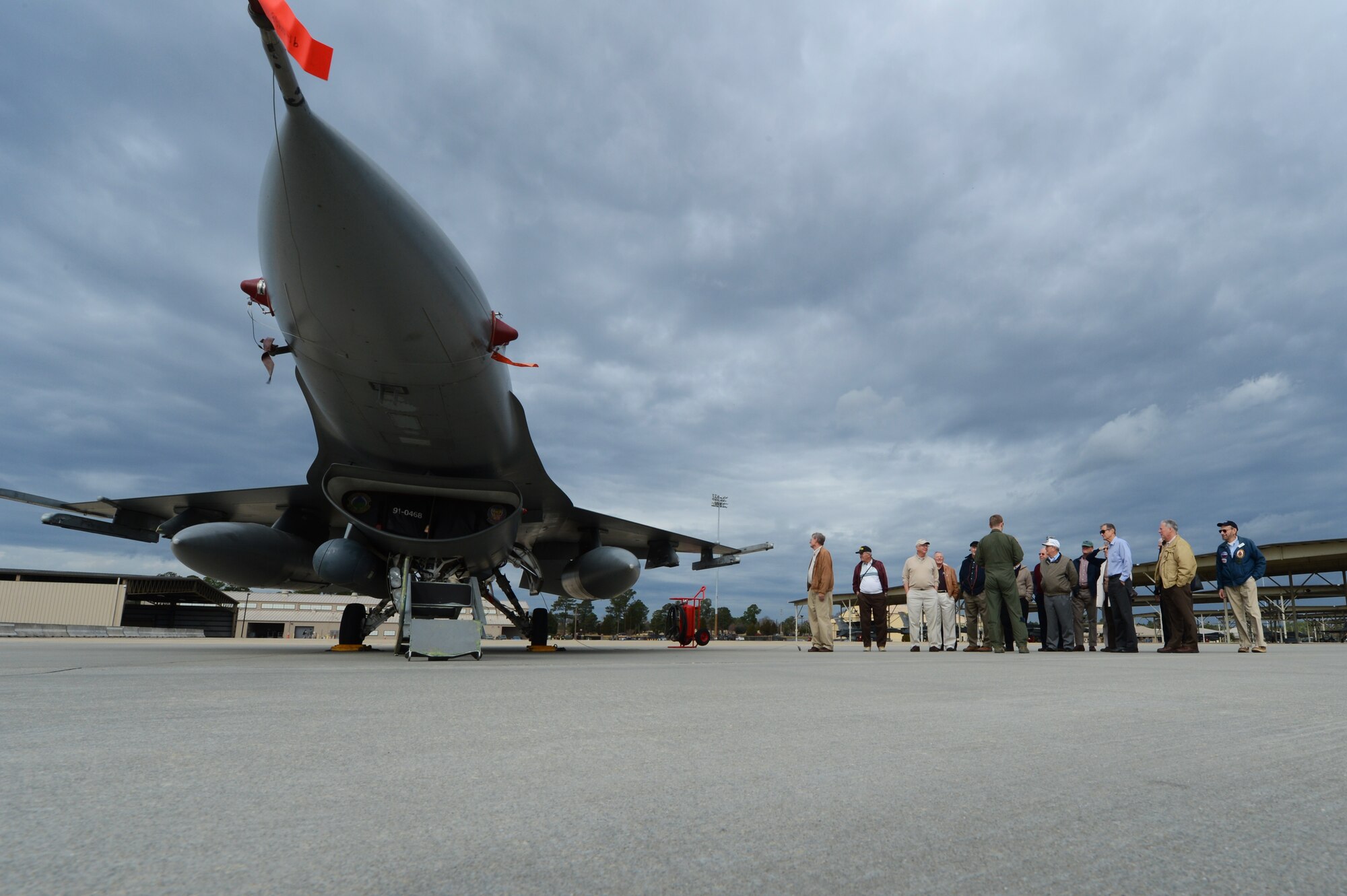 Retired veterans gather next to an F-16 Fighting Falcon at Shaw Air Force Base, S.C., Jan. 22, 2013.  Veterans toured Shaw and visited the 79th Fighter Squadron as well as the weapons load barn where they were briefed on operations at Shaw and procedures for loading weapons onto aircraft. (U.S. Air Force photo by Airman 1st Class Nicole Sikorski/Released)
