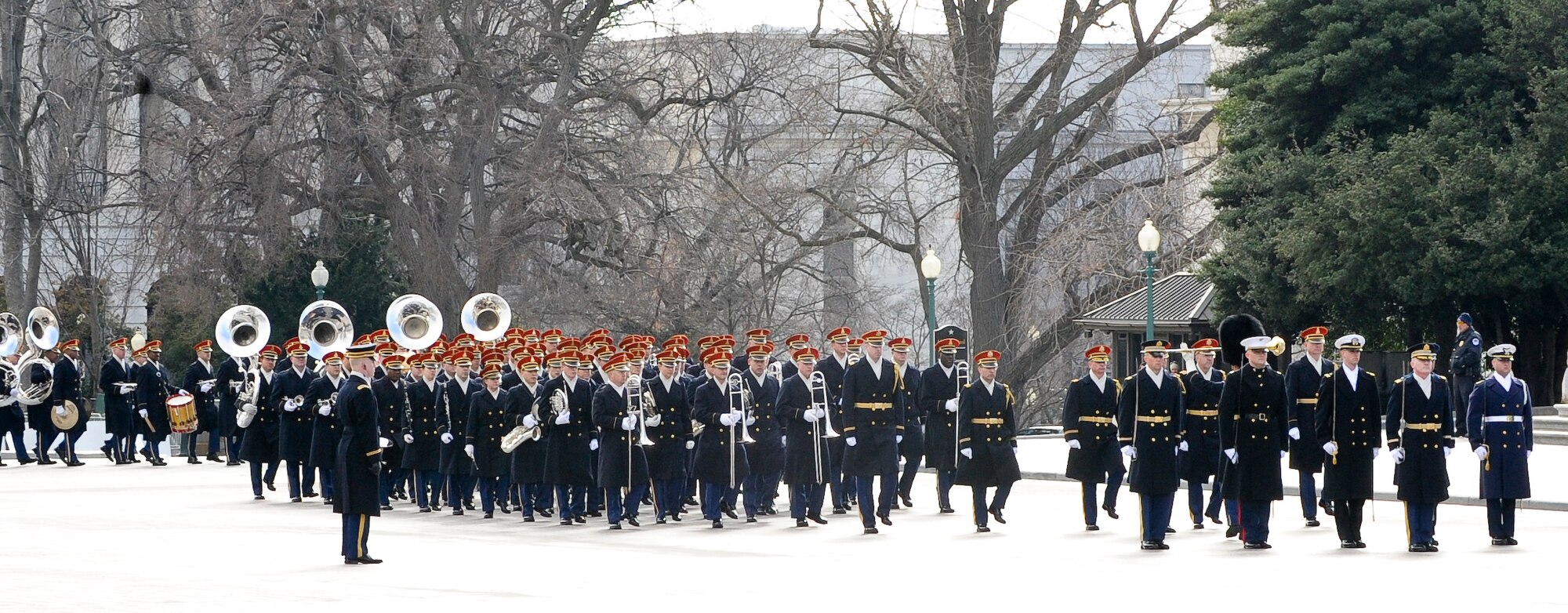 Members of the United States Military stage at the pass in review start point outside the Capitol Building in Washington, Jan. 21, 2013. Military involvement in the presidential inauguration dates back to April 30, 1789, when members of the U.S. Army, local militia units and revolutionary war veterans escorted George Washington to his first inauguration ceremony. (DOD photo by U.S. Air Force Staff Sgt. Wesley Farnsworth/Released)