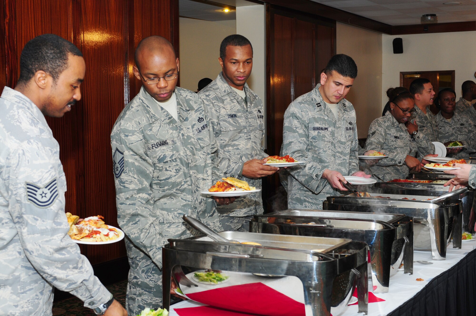 ROYAL AIR FORCE LAKENHEATH, England -- Airmen from the 48th Fighter Wing line up for a buffet lunch at Eagles' Landing during the Dr. Martin Luther King, Jr. Observance Luncheon Jan. 18, 2013. The luncheon also included a special presentation from the RAFL Middle School drama club and guest speaker Col. James M. Durant III, director of legal services for United States Air Forces in Europe. (U.S. Air Force photo by Airman 1st Class Dana Butler)

