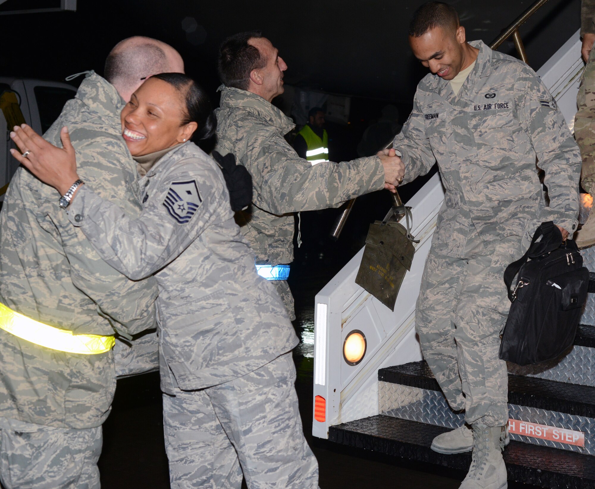 Brig. Gen. Scott Zobrist, 31st Fighter Wing commander and Chief Master Sgt. Jeffrey Craver, 31st FW command chief, greet members of the 603rd Air Control Squadron upon returning from deployment Jan. 19, 2013 at Aviano Air Base, Italy. The unit returned from their final deployment before the squadron is deactivated later this year. Since the start of the squadron's deployment in July, the Airmen supported roughly 255,000 square miles of airspace in Afghanistan, while providing support for more than 35,000 Coalition combat sorties. (U.S. Air Force photo/Senior Airman Michael Battles)