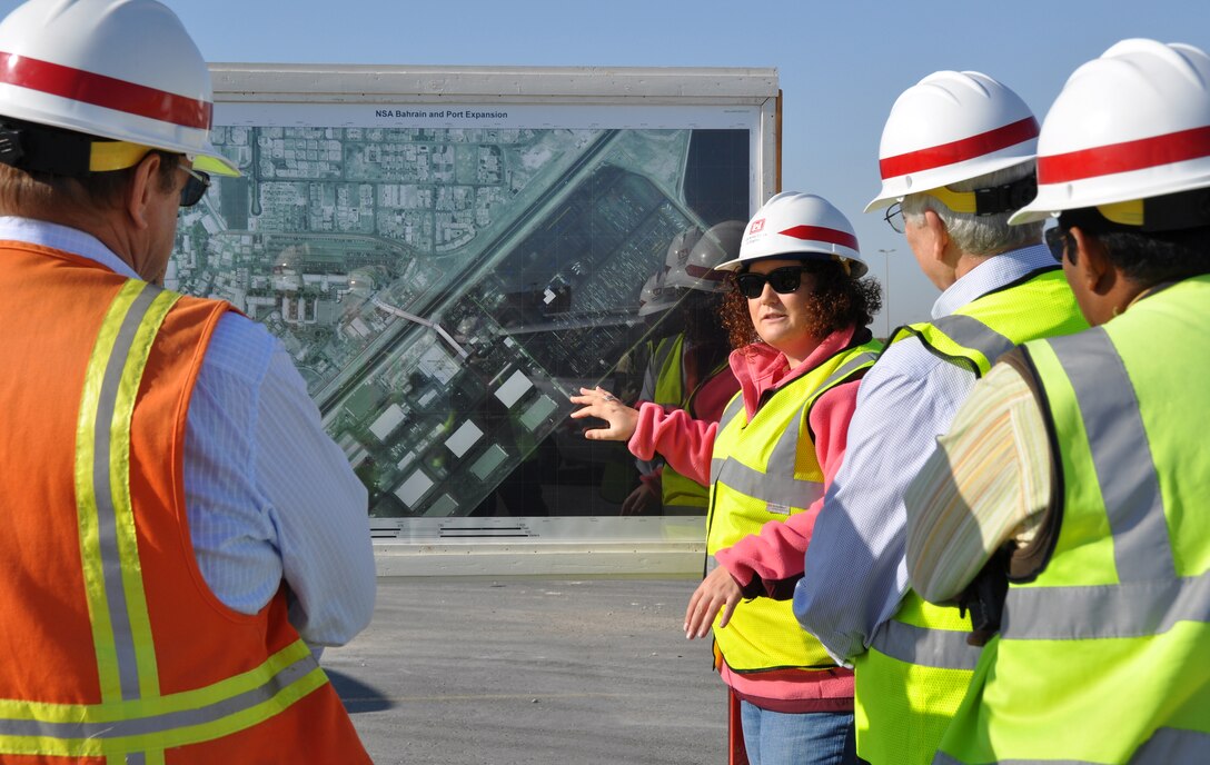 Mollie Bednarowski, project engineer, explains the site layout of the waterfront development project in Bahrain to Roger Thomas, chief, Construction Operations Division. Photo by Joan Kibler.