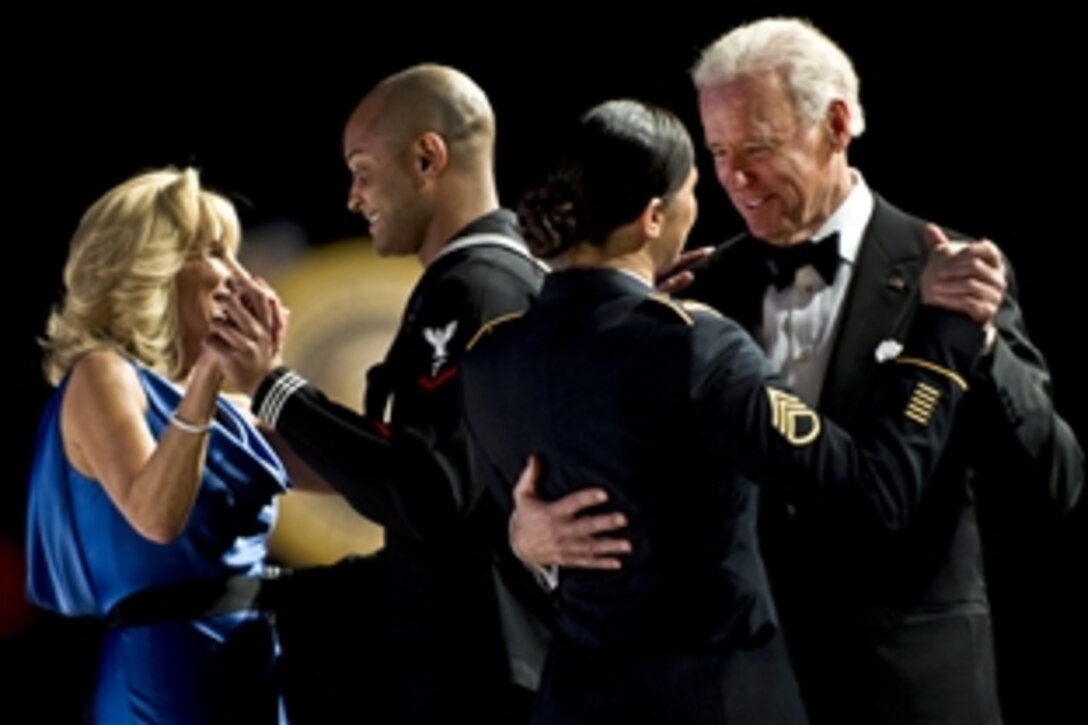 Vice President Joe Biden dances with Army Staff Sgt  Keesha Dentino and his wife, Dr. Jill Biden, dances with Navy Petty Officer 3rd Class Patrick  Figuero at the Commander in Chief 's Ball in  Washington, D.C., Jan. 21, 2013.
