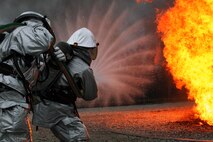 Aircraft Rescue and Firefighting Marines aboard Marine Corps Air Station New River, N.C., battle a blaze during a live-fire training exercise, Jan. 17. The Marines took turns rotating through each role of the fire fighter, gaining valuable experience and confidence.