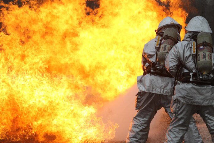 Aircraft Rescue and Firefighting Marines aboard Marine Corps Air Station New River, N.C., battle a blaze during a live-fire training exercise, Jan. 17. The Marines took turns rotating through each role of the fire fighter, gaining valuable experience and confidence.