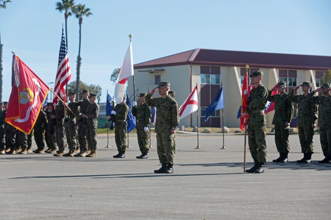 MARINE CORPS BASE CAMP PENDLETON, Calif. - U.S. Marines and Sailors with 13th Marine Expeditionary Unit and members of the Japan Ground Self-Defense Force participate in the opening ceremony of Exercise Iron Fist 2013 aboard Marine Corps Base Camp Pendleton, Calif. Jan. 22, 2013.During Iron Fist 2013, the 13th MEU and Western Army Infantry Regiment, JGSDF will spend three weeks participating in bilateral training to improve their interoperability, enhance military-to-military relations and sharpen skills essential to crisis response. 
(U.S. Marine Corps photo by Gunnery Sgt. Jared Padula/Released)
