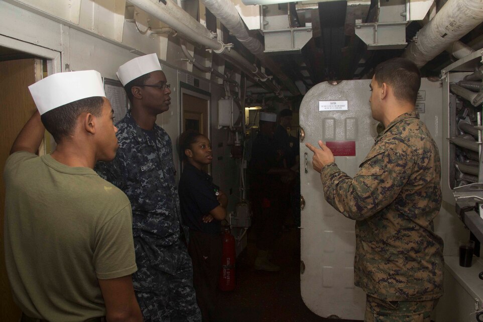Marines of the 26th Marine Expeditionary Unit (MEU) and Sailors from the USS Kearsarge break out food supplies from the deep storage aboard the Kearsarge while at sea Jan. 17, 2013. The MEU and Amphibious Squadron (PHIBRON) 4 are conducting PHIBRON-MEU Integration in preparation for their Composite Training Unit Exercise, the final phase of a six-month pre-deployment training program. The 26th MEU operates continuously across the globe, providing the president and unified combatant commanders with a forward-deployed, sea-based quick reaction force. The MEU is a Marine Air-Ground Task Force capable of conducting amphibious operations, crisis response and limited contingency operations. (U.S. Marine Corps photo by Cpl. Michael S. Lockett/Released)