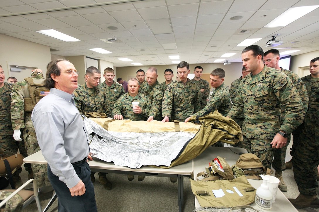 Brian W. Cavolt, CEO of JBC Corp., shows Marines and sailors with I Marine Expeditionary Force and 7th Engineer Support Battalion, 1st Marine Logistics Group, new tactical combat casualty care equipment at Camp Pendleton, Calif., Jan. 15. The new gear is available to the service members for an upcoming humanitarian mission to Vietnam.


